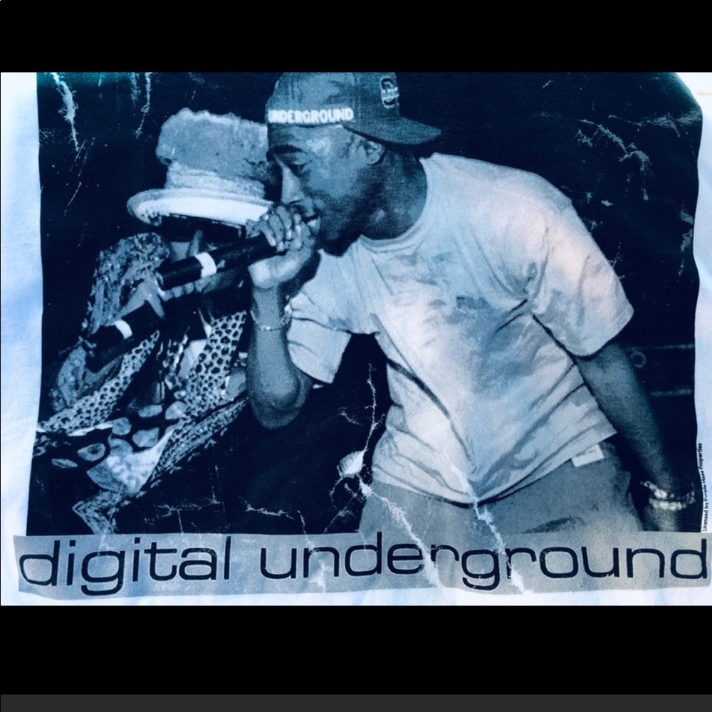 Iconic rappers Tupac and Shock G performing on stage as Digital Underground.